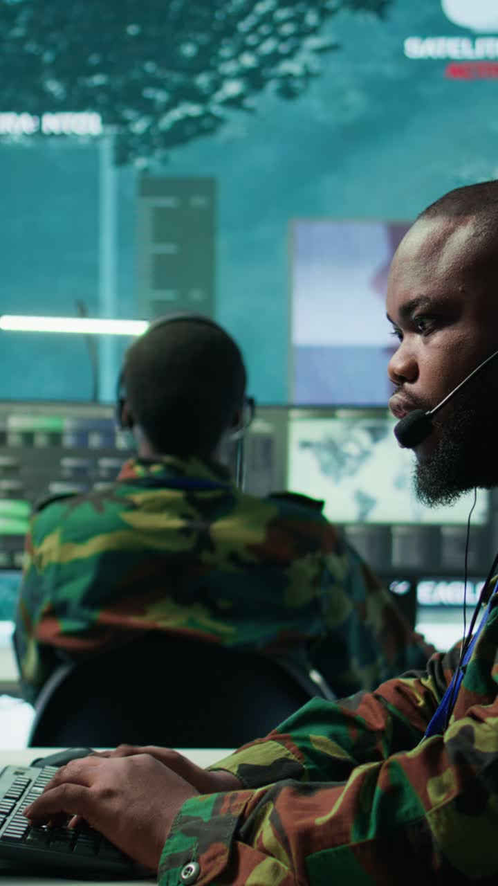 Vertical Video Government intelligence officers in control room manage surveillance operations