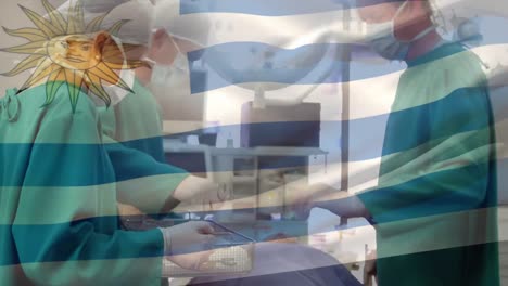 Animation-of-flag-of-uruguay-waving-over-surgeons-in-operating-theatre