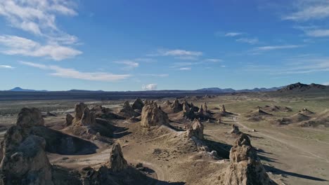 high aerial view moving slowly over the trona pinnacles rock formations on a sunny morning