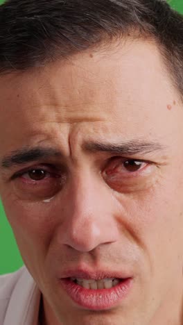 desperate adult man crying and shaking his head