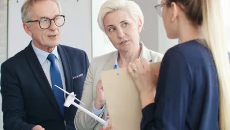 close up of coworkers talking about renewable energy