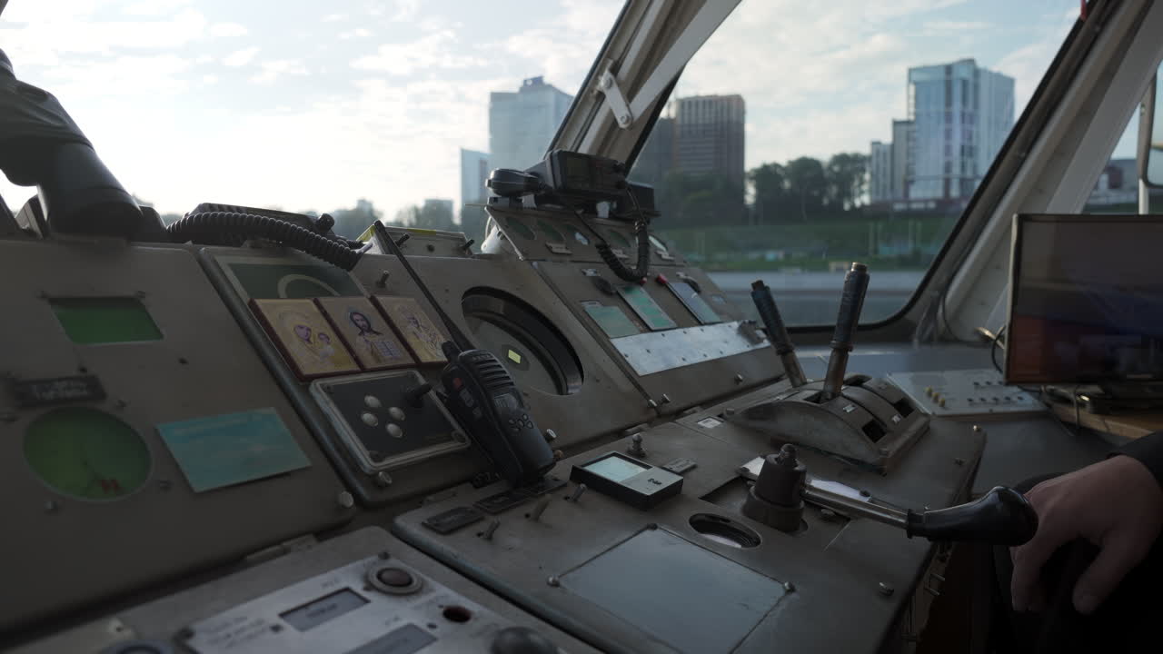 Ship's wheelhouse with cityscape view