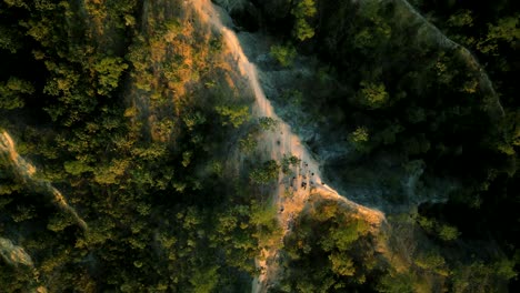 4K-Cinematic-nature-aerial-drone-footage-of-the-beautiful-mountains-of-Mae-Hong-Son-at-the-famous-canyon-next-to-Pai,-Thailand-during-sunset