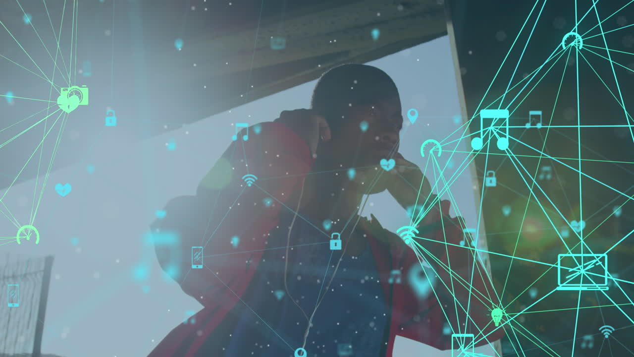 아프리카계 미국인 남자가 이어폰을 사용하여  ⁇  아래에서 운동하는 연결 네트워크의 애니메이션