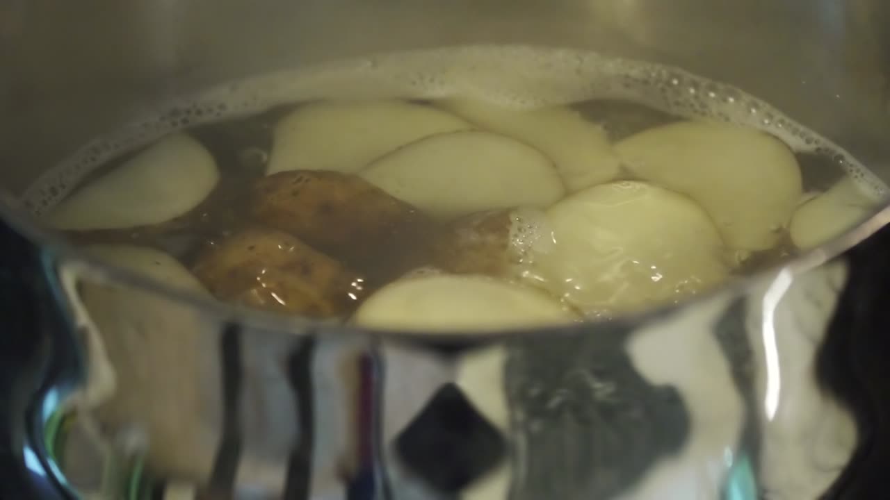 Potatoes boiling in slow motion