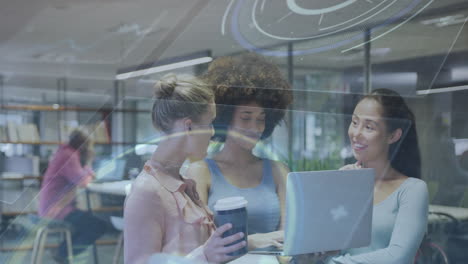 three women collaborating at office with digital technology animation overlay