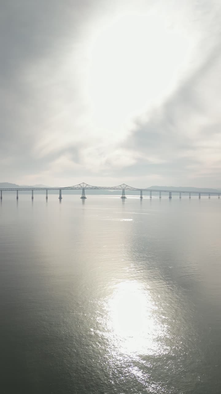 From above, the Richmond-San Mateo Bridge arcs gracefully over the bay.