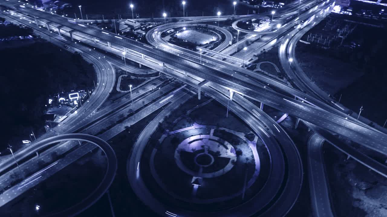 Time-lapse or Hyper-lapse Aerial view highway road at night for transportation or traffic.