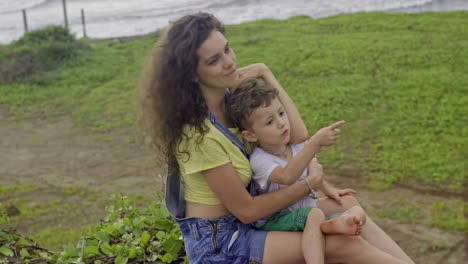 mother and son resting outdoors