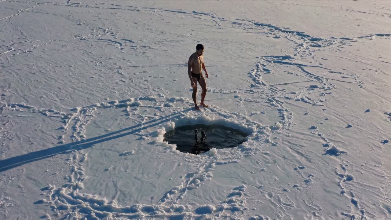 Man Ice Swimming in Winter