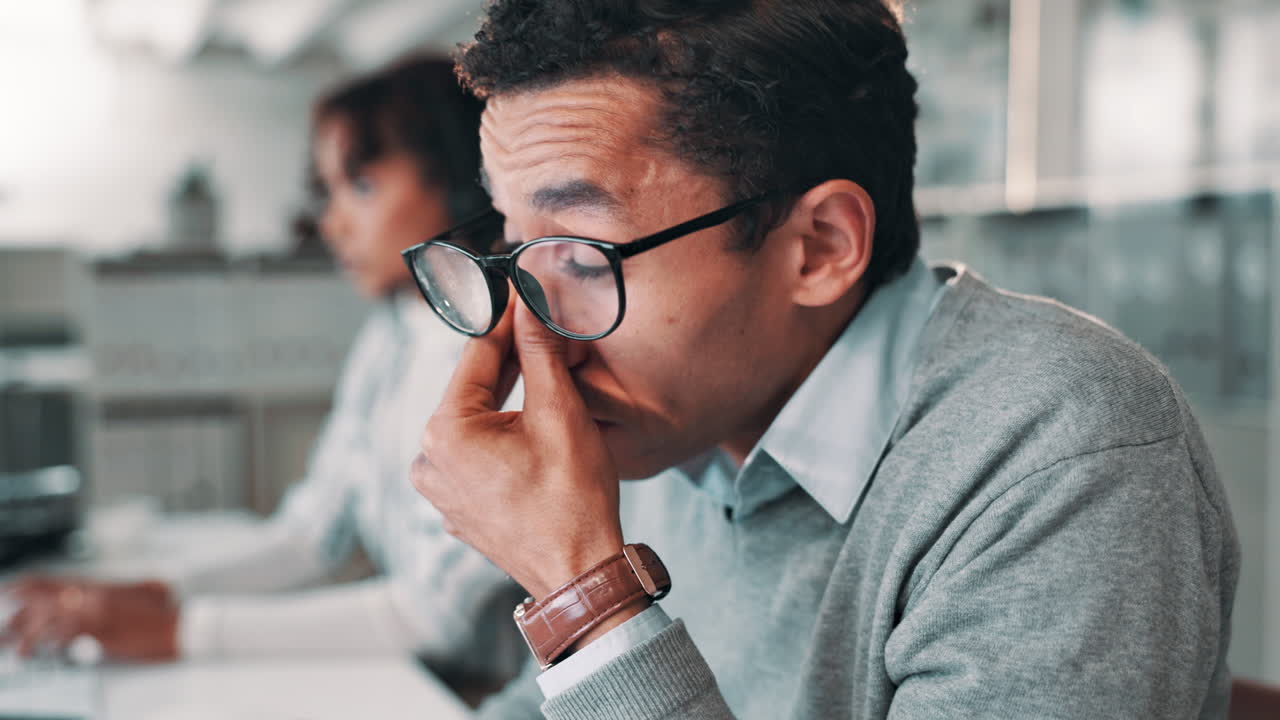 Tired businessman in office