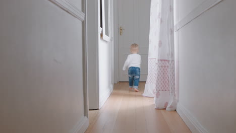 baby boy learning to walk toddler exploring home curious infant walking through house enjoying childhood