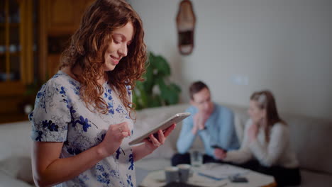 Young-Smiling-Successful-Female-Using-Digital-Tablet-Computer-Doing-Online-Shopping-And-Checking-Email-3