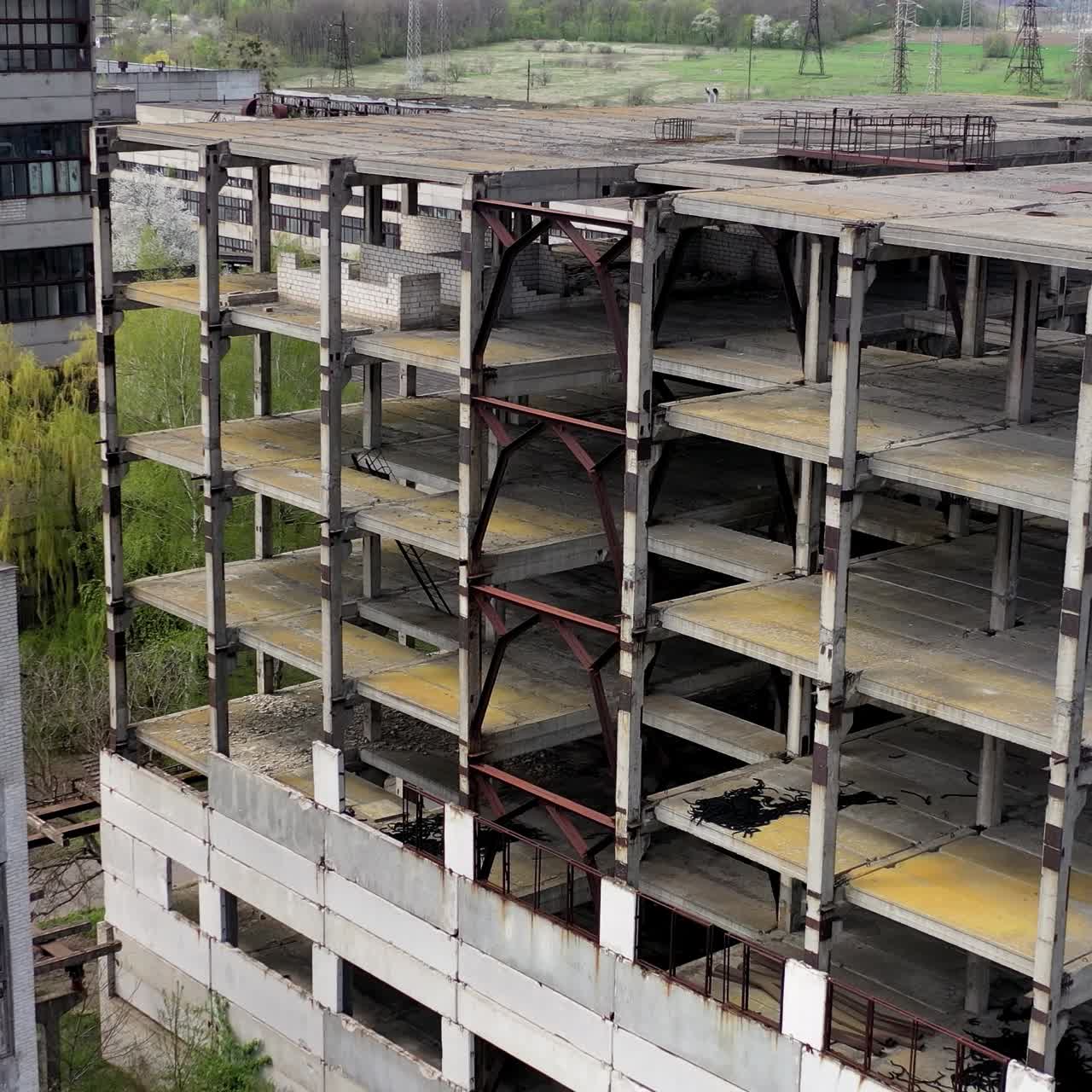 Aerial view of ruined abandoned building. Empty apocalipse city with damaged houses