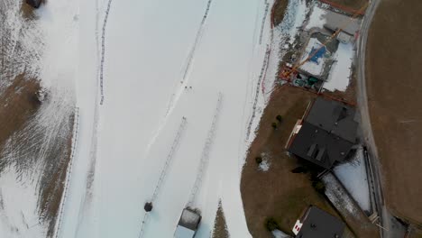 top down aerial shot over a ski trail near sappada ski mountain in italy