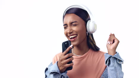 Woman,-headphones-and-phone-in-studio