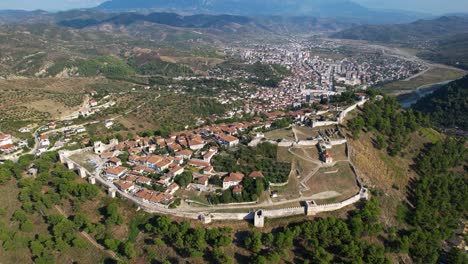 Discovering-the-Enchanting-Old-City-of-Berat-inside-the-Castle:-A-Historic-Neighborhood-Perched-on-a-Hill,-Surrounded-by-Lush-Pine-Forests