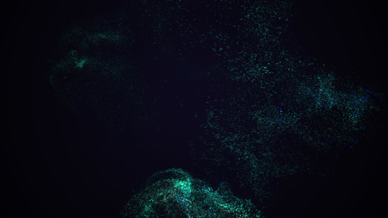 Spinning motion of blue dust splashes on the black background.