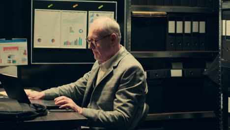 Private detectives reviewing forensic evidence folders in police archive room