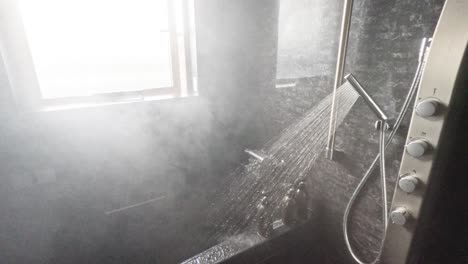 shower running, creating steam in a bathroom