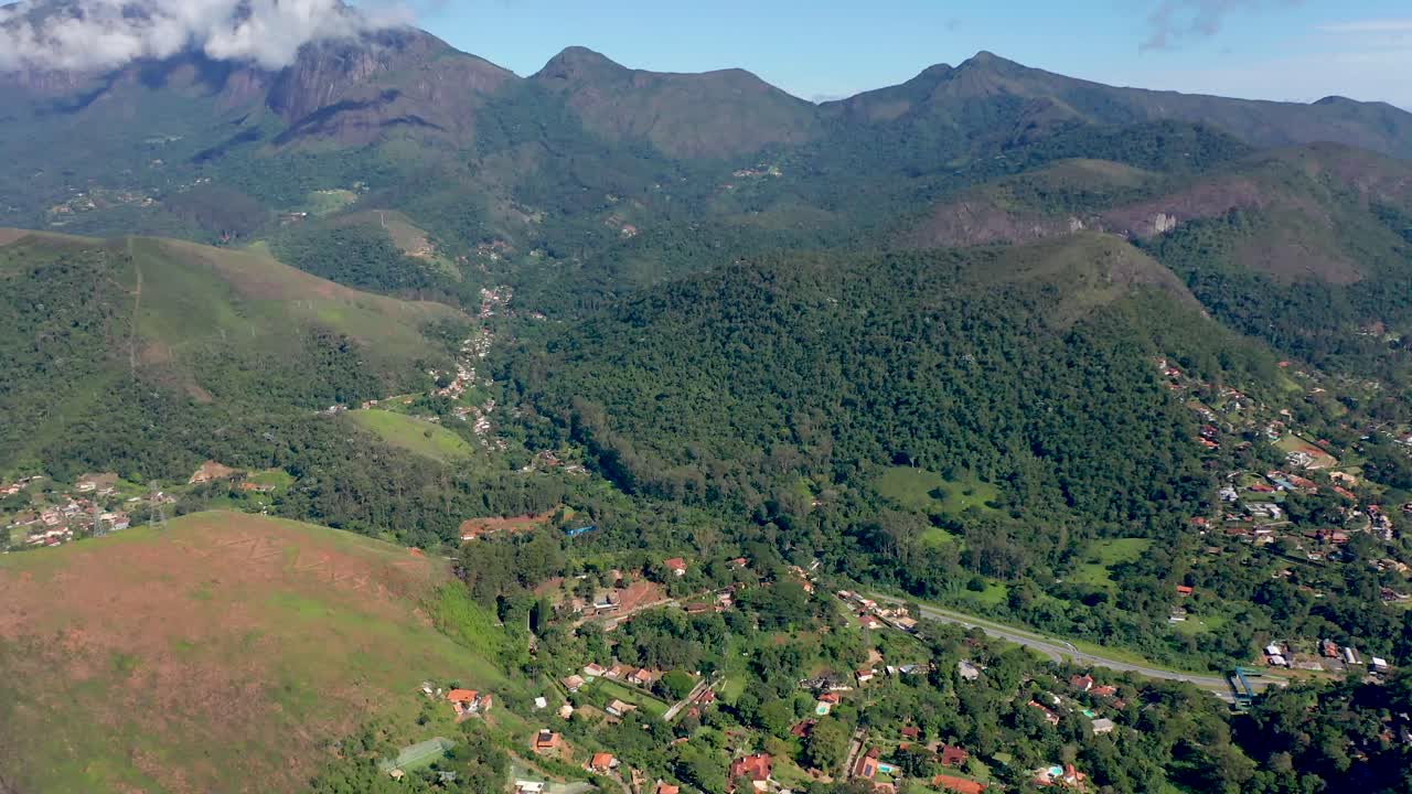 Aerial pan of Serra dos Orgãos Mountains, city of Petrópolis, Access Road 040.