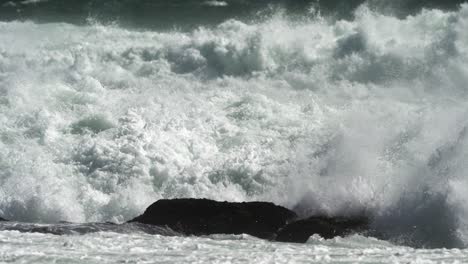 powerful waves crashing on rocks