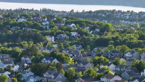 Aerial-drone-view-over-an-idyllic-suburban-neighborhood-in-the-summer