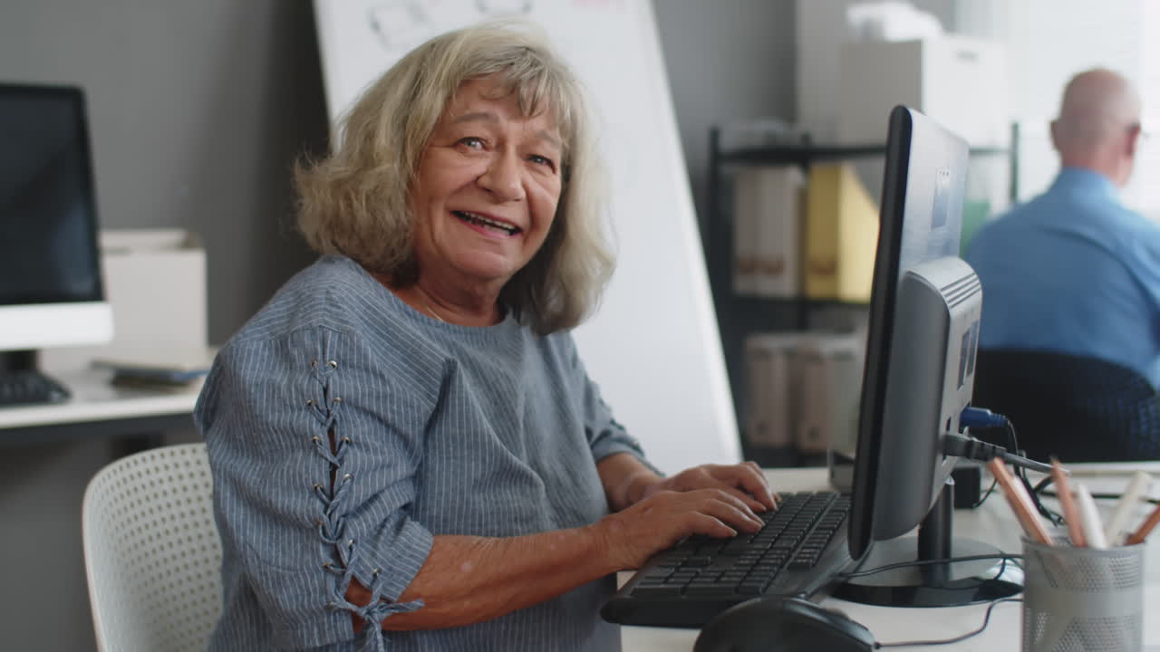 Portrait of Mature Woman Attending Computer Class