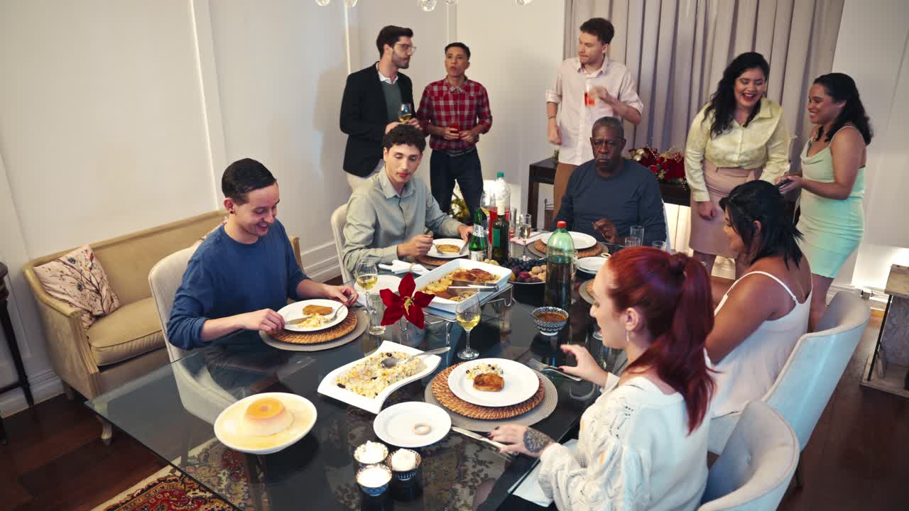 A group of people enjoying a meal together at a dining table