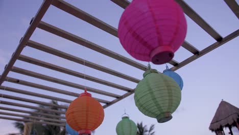 paper lanterns suspended on a wire at a lounge in a mexican resort