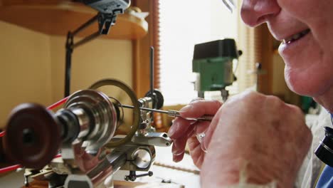 horologist using a machine