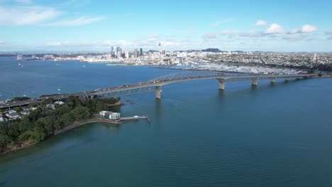 aerial view of auckland harbour bridge and city skyline