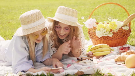 two friends enjoying a picnic in the park