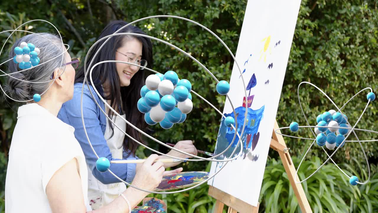 Tutor guiding senior woman painting castle art for education outdoors, molecular models overlapping
