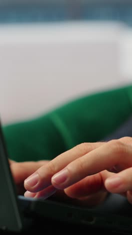 Vertical Video Close up of businessman typing information for daily tasks on laptop