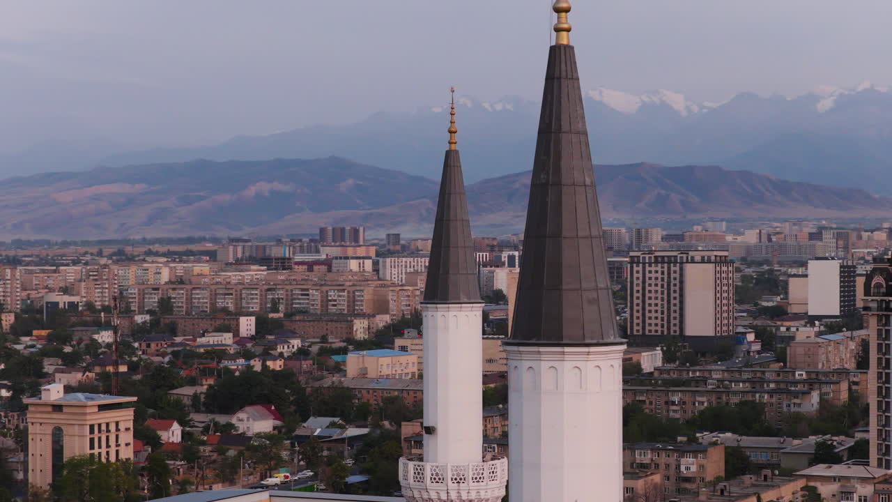The Central Mosque Minarets In Bishkek, Kyrgyzstan At Sunset. Aerial Orbiting Shot