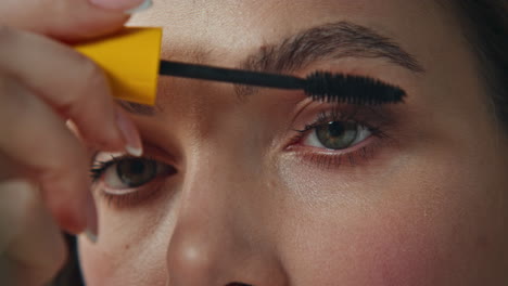 applying mascara to eyelashes
