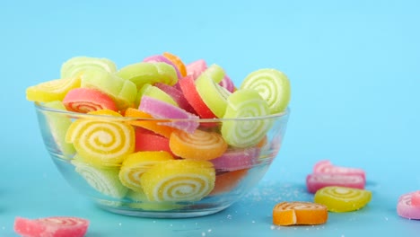 colorful spiral gummy candies in a glass bowl