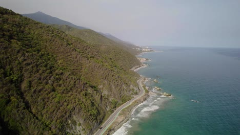 coastline road along a green mountain overlooking the caribbean sea, venezuela