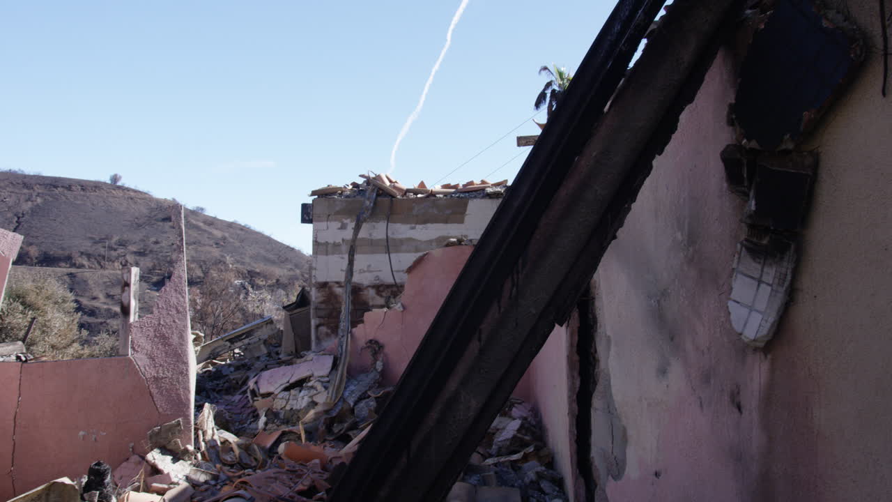 Fallen wooden beam from burned home in Malibu, California. Woolsey Fire.