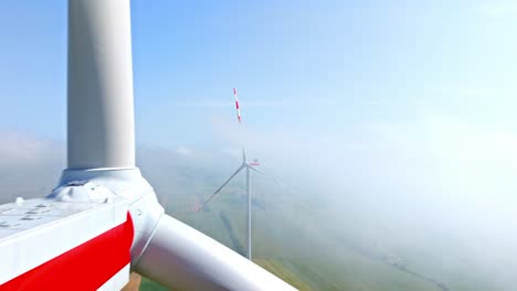 wind turbine propeller blades, foggy landscape in weinviertel, austria - aerial, close up