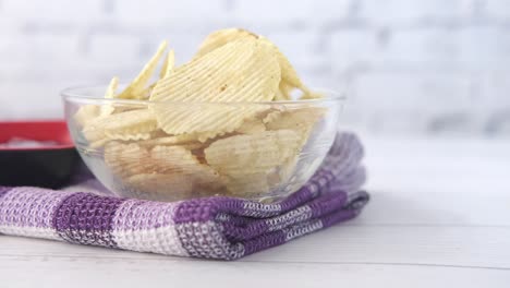 crispy potato chips in a glass bowl