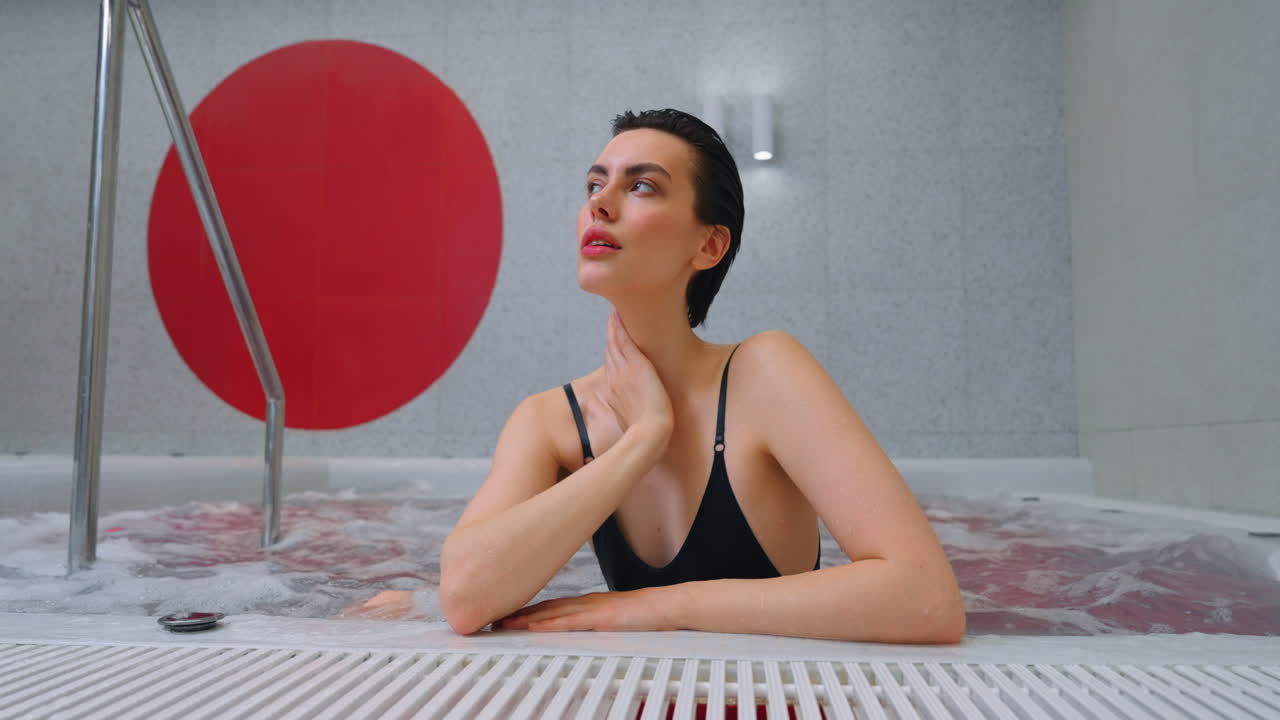 Woman Relaxing in a Modern Hot Tub