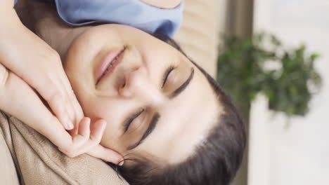 vertical video of woman lying on the sofa is resting.