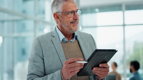 senior businessman using tablet in office