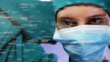 Animation-of-covid-19-text-over-surgeon-in-face-mask