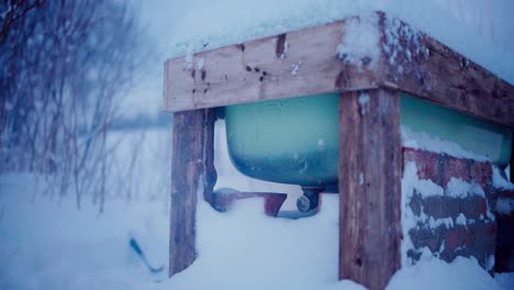 steaming diy hot tub outdoor during freezing winter season