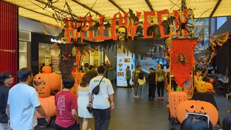 halloween decorations and crowds of people visiting the pavilion shopping centre in bukit bintang capital city of kuala lumpur, malaysia