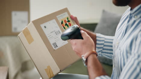 a person scans a shipping box
