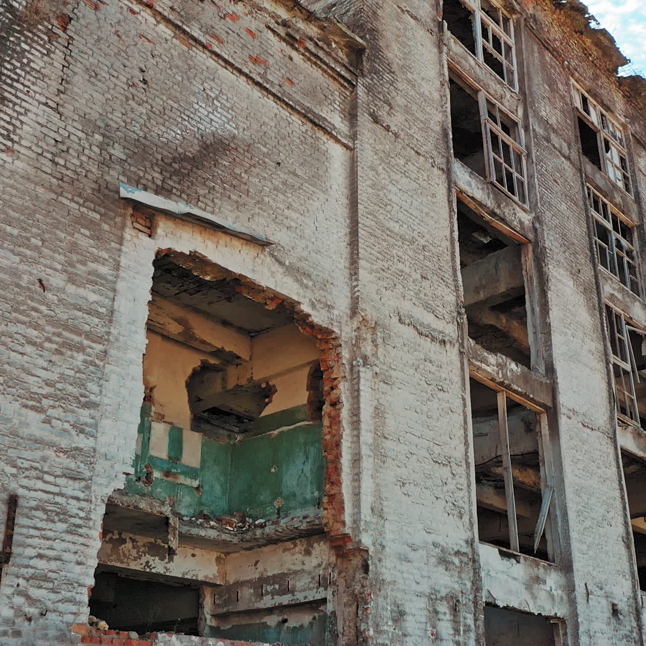 Old industrial building for demolition. Abandoned building exterior. Aerial view.